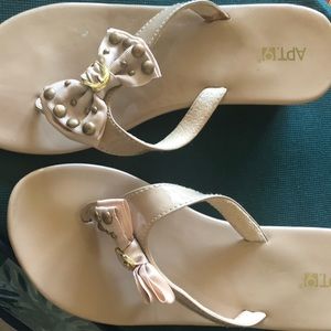 Sandals. (between toe flip flops)